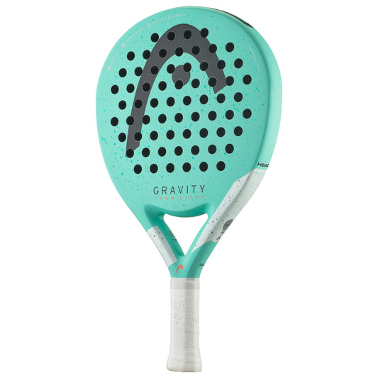 A mint-colored padel racket from HEAD with black dots and the word "GRAVITY" prominently displayed. This HEAD Gravity Team Light 2024 model incorporates Graphene 360+ technology and includes Control Foam for enhanced precision. The handle is beautifully wrapped in white grip tape.