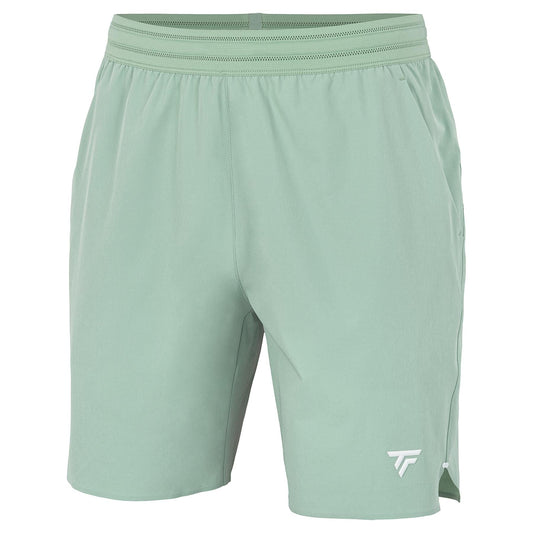 The Tecnifibre Team Stretch Mens Padel Shorts in sage green feature an elastic waistband, a small white logo on the lower right leg, and lightweight stretch fabric for comfort—ideal for active days.