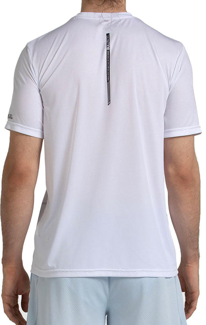 A person is shown from the back wearing a Bullpadel Casinas Mens Padel T-Shirt in white with light shorts. The shirt features QuickerDry technology and a small black tag hanging from the collar.