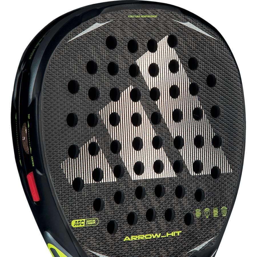 Close-up of the adidas Arrow Hit 2026 Padel Racket, showing a bold white adidas logo, intelligent balance system, round holes, and yellow “ARROW-HIT” text on the lower section—crafted for outstanding power in padel play.