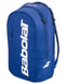 The Babolat Court Lite Padel Backpack in dark blue features white logo lettering and two zippered compartments, including a dedicated racket space. Shown angled on a plain background.