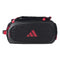 The adidas Tour 3.4 Padel Racket Bag in black features red zippers, straps, and a red logo. It offers thermal insulation—ideal for padel rackets—and is shown against a plain white background.
