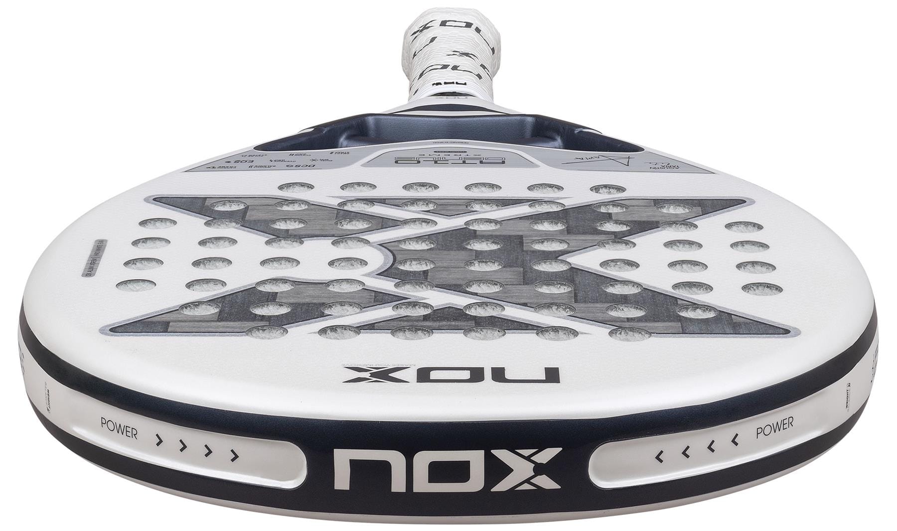 Close-up of the NOX AT10 Genius 12K Alum Extrem Lite By Agustín Tapia 2026 padel racket, mainly white with black details, bold "X" design, and visible NOX branding highlighting its advanced weight balance system.