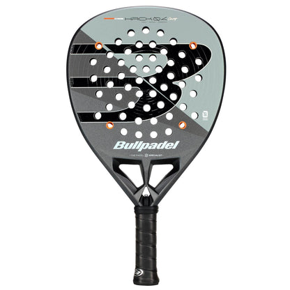 The Bullpadel HACK 04 Comfort 2026 Padel Racket – Grey features a dynamic power design with a large "B" logo, multiple round holes, grey and black colors, and a black grip handle.