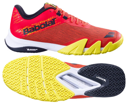 Introducing the Babolat Jet Viva Padel Shoes in Poppy Red with yellow and black accents. Ideal for dynamic performance, they feature "Babolat" on the side and a Michelin-branded sole for exceptional grip.