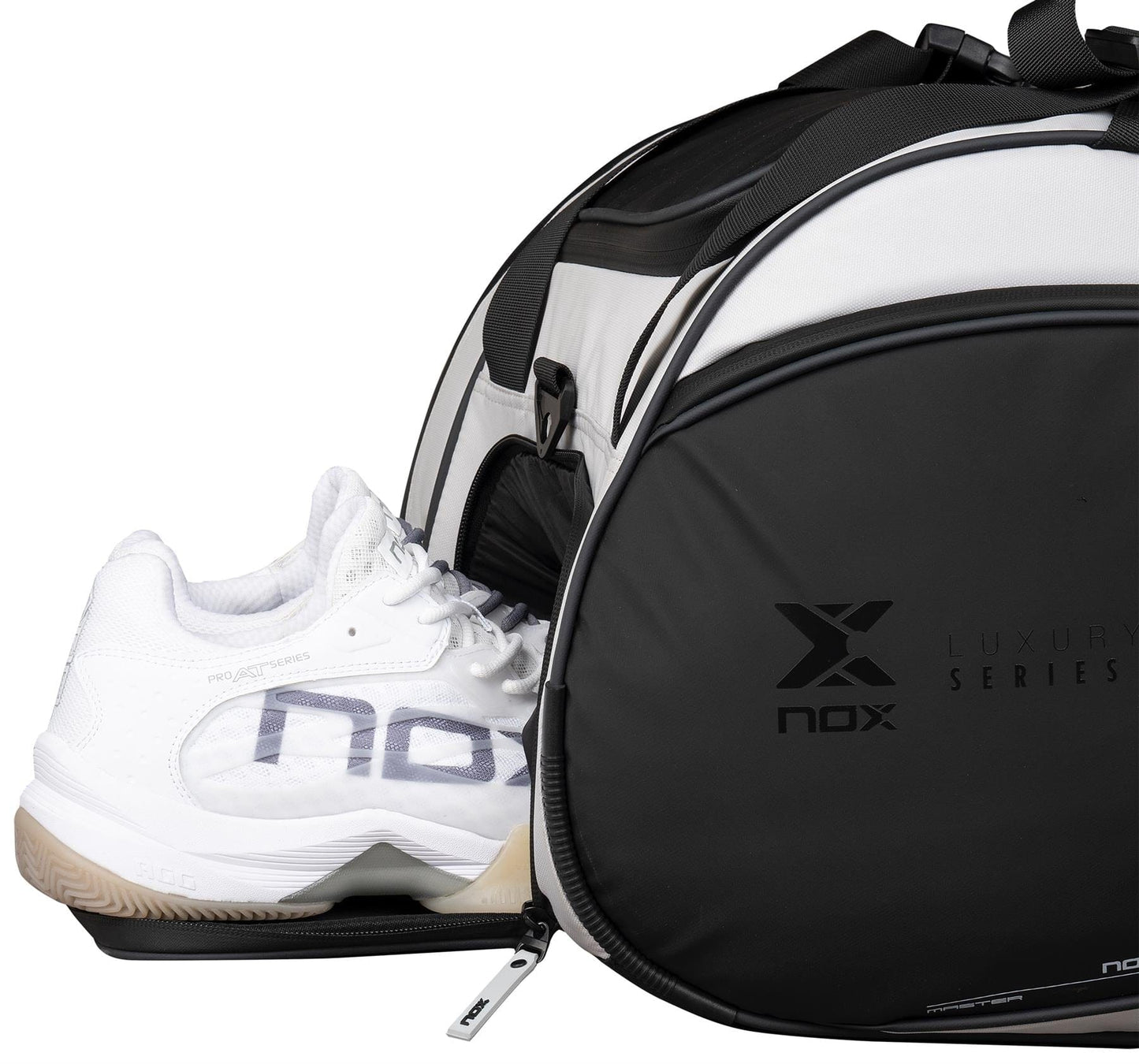A black and white NOX Luxury Master Series Padel Racket Bag with "nox" branding is shown with a zippered compartment partially open, revealing white athletic shoes similar to those used by Miguel Lamperti.