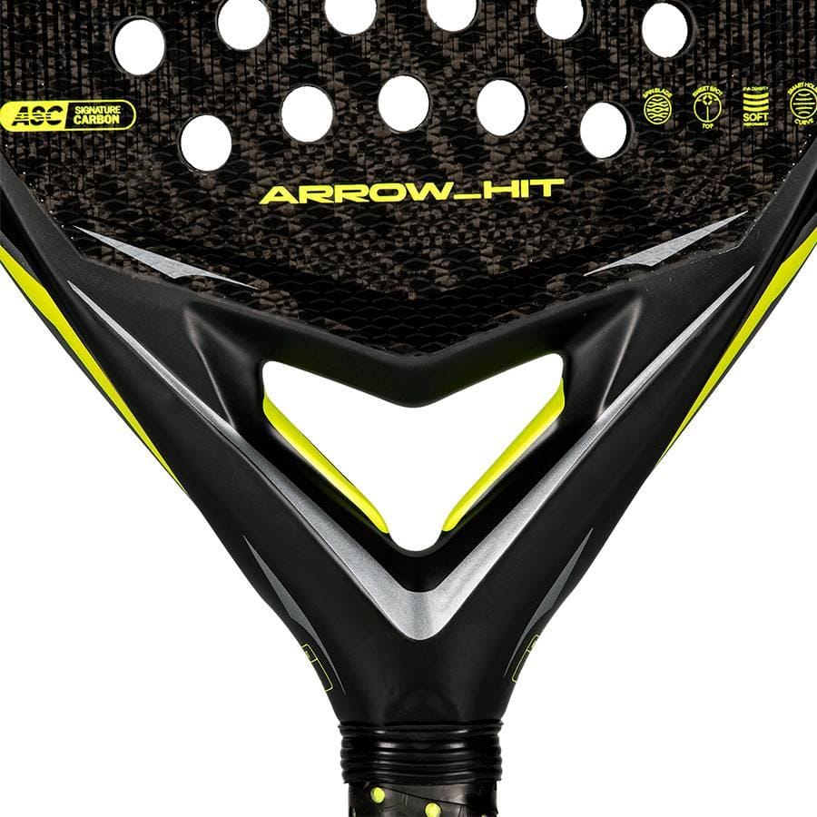 Close-up of the adidas Arrow Hit 2026 Padel Racket, featuring a black and yellow design, carbon texture, round holes, striking geometric accents, and an intelligent balance system for powerful padel performance.