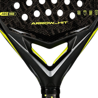 Close-up of the adidas Arrow Hit 2026 Padel Racket, featuring a black and yellow design, carbon texture, round holes, striking geometric accents, and an intelligent balance system for powerful padel performance.