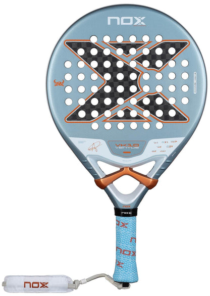 The NOX Luxury VK10 Ventus Control 12K By Aranzazu Osoro 2026 padel racket features a light blue design, large black "X," orange details, 12K carbon construction, perforated surface, and a padded blue grip with white wrist strap.