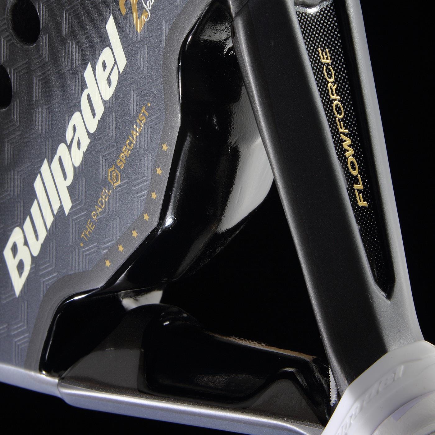 Close-up of the Bullpadel Flow Legend 2026 Padel Racket - Black, featuring Alejandra Salazar’s logo, "The Padel Specialist" slogan with stars, and "FLOW FORCE" text on its black metallic textured surface.