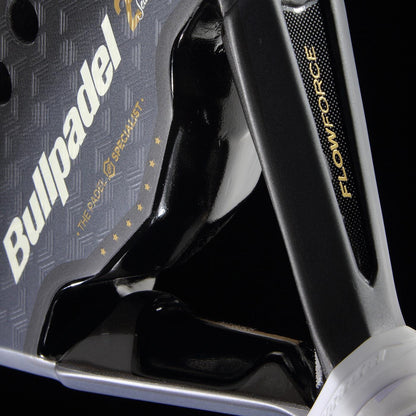 Close-up of the Bullpadel Flow Legend 2026 Padel Racket - Black, featuring Alejandra Salazar’s logo, "The Padel Specialist" slogan with stars, and "FLOW FORCE" text on its black metallic textured surface.