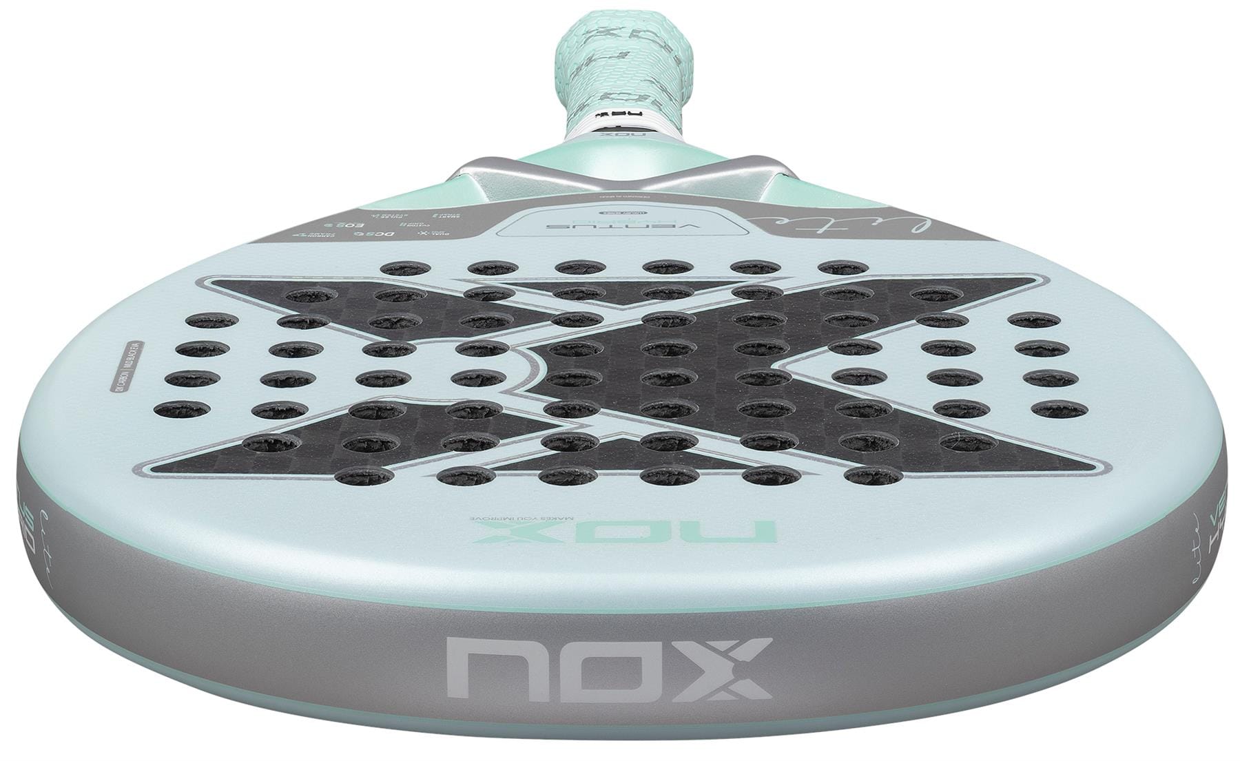 Close-up of the NOX Luxury Ventus 12K Hybrid Lite 2026 Padel Racket in blue, featuring a gray face with a large black "X," small holes on the 12K carbon fibre surface, and a textured grip handle.