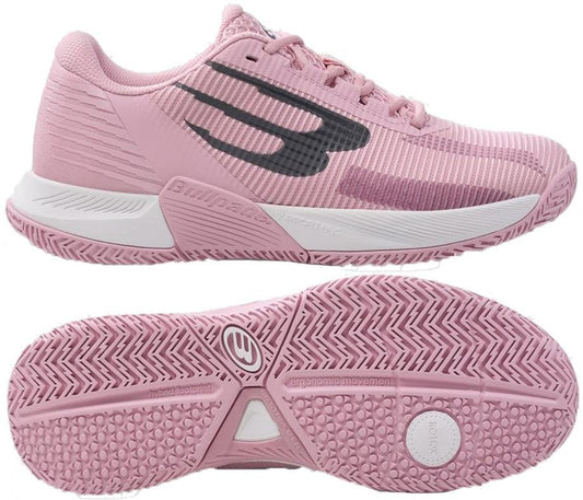 A pair of Bullpadel Performance Comfort 26V Women's Padel Shoes in pink, featuring a black side logo. One shoe is shown in profile, the other displays the textured sole designed for stability and superior court grip.