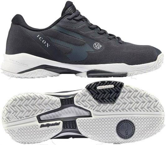 A pair of navy Bullpadel Icon 26V men's padel shoes with white soles, shown from the side and bottom. These lightweight court shoes feature a textured surface, lace-up front, and “ICON” branding on the side.