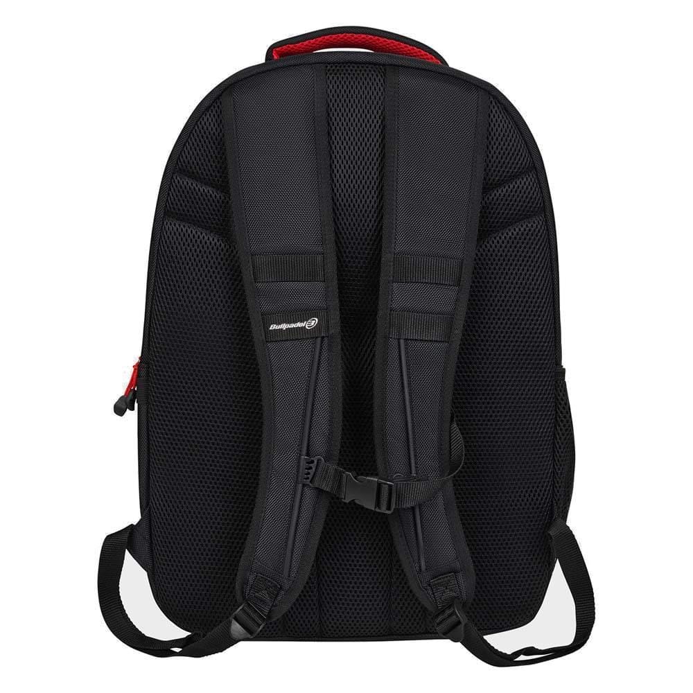 The Bullpadel BPM26020 Neuron Padel Backpack in black is shown from the back, featuring padded shoulder straps, an adjustable chest strap, a red top handle, and a textured mesh-like back panel for comfort.