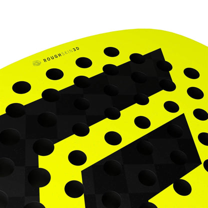 Close-up of the Tecnifibre Bomba Max Padel Racket by Tecnifibre, featuring a bright yellow surface with raised black circular bumps and "ROUGHSKIN 3D" text near the edge, engineered for explosive power.