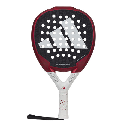 The ADIDAS Metalbone Team 3.3 Padel Racket by adidas features a red and black design with a white handle and diamond-shaped head. It boasts a honeycomb pattern with circular holes, accented by a prominent white logo. With an attached wrist strap, this racket provides improved control for every swing.