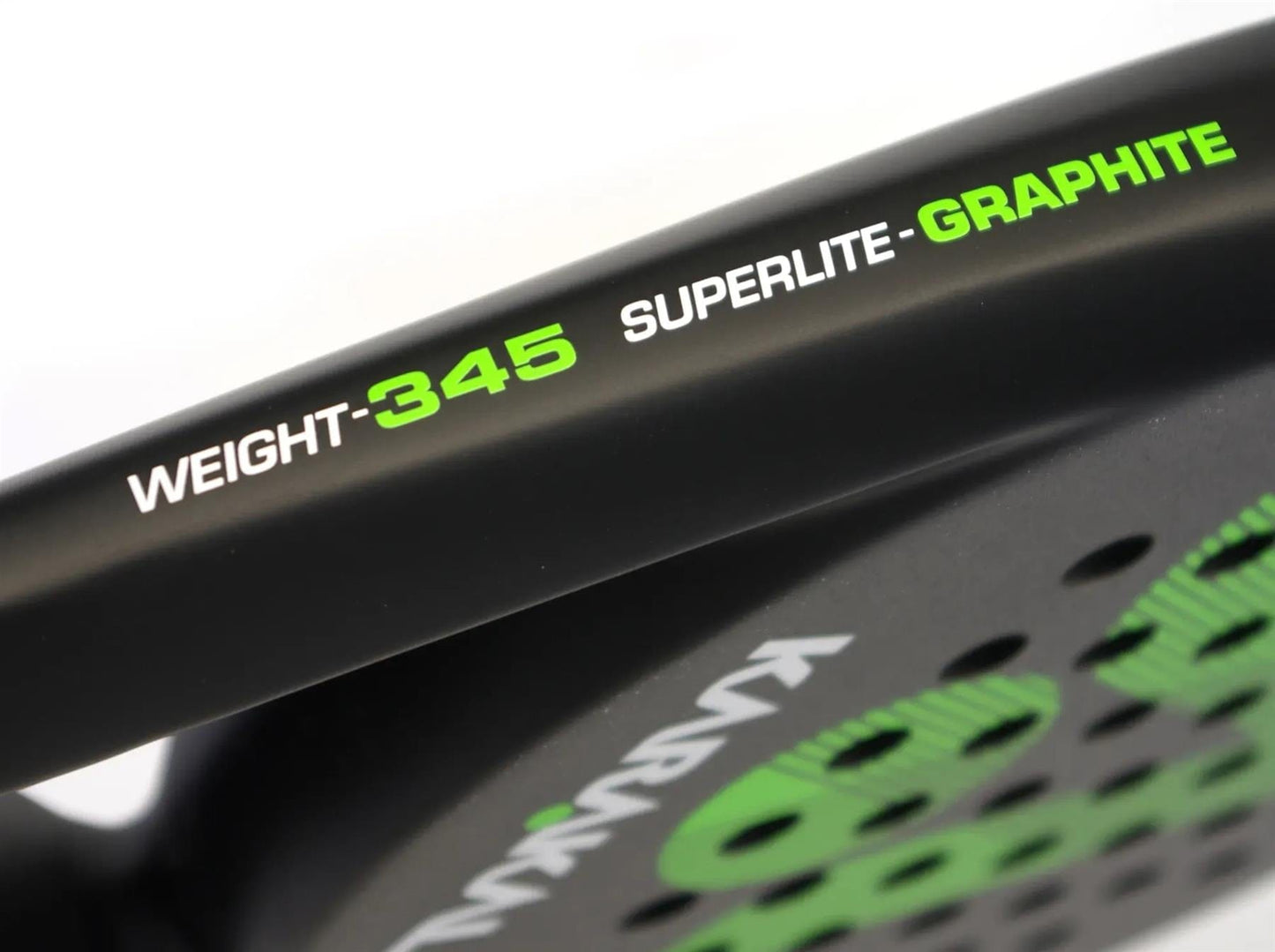 Close-up of the Karakal Air Lite 345 Green Padel Racket by Karakal, a lightweight paddle with "WEIGHT: 345 SUPERLITE - GRAPHITE" in green and white on the frame, shown next to a dotted design on its surface.