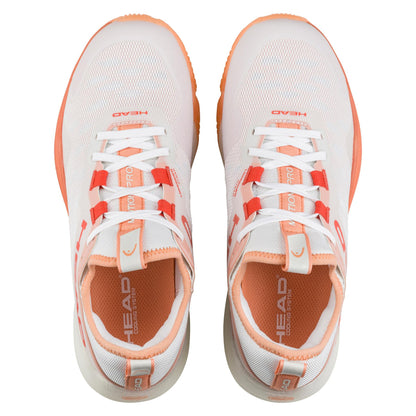 Top view of the HEAD Motion Pro Women's Padel Shoes in White/Coral. These shoes, highlighted by coral on laces and soles, feature DynaFoam cushioning and prominently display the HEAD brand name on the tongue and sides.