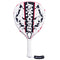 The Babolat Technical Vertuo Juan Lebrón Padel Racket, with "Babolat" in bold black letters on its white and red face, is ideal for Technical Strikers. It features a perforated design, white grip, and a black wrist strap with the iconic Babolat logo.