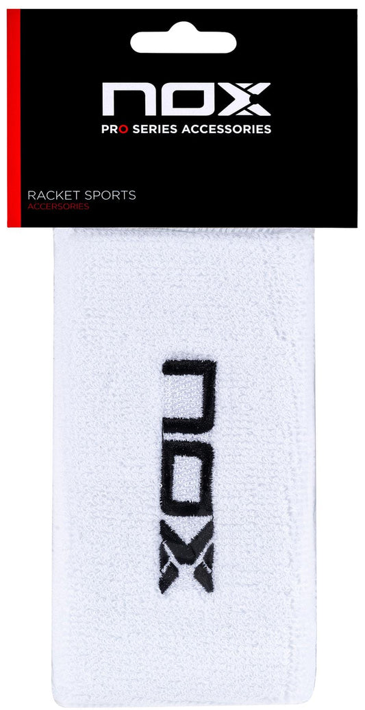 The NOX Padel Long Wristband in white with a black NOX logo uses Balance Fresh technology and comes in black and red packaging labeled "NOX Pro Series Accessories" for racket sports.