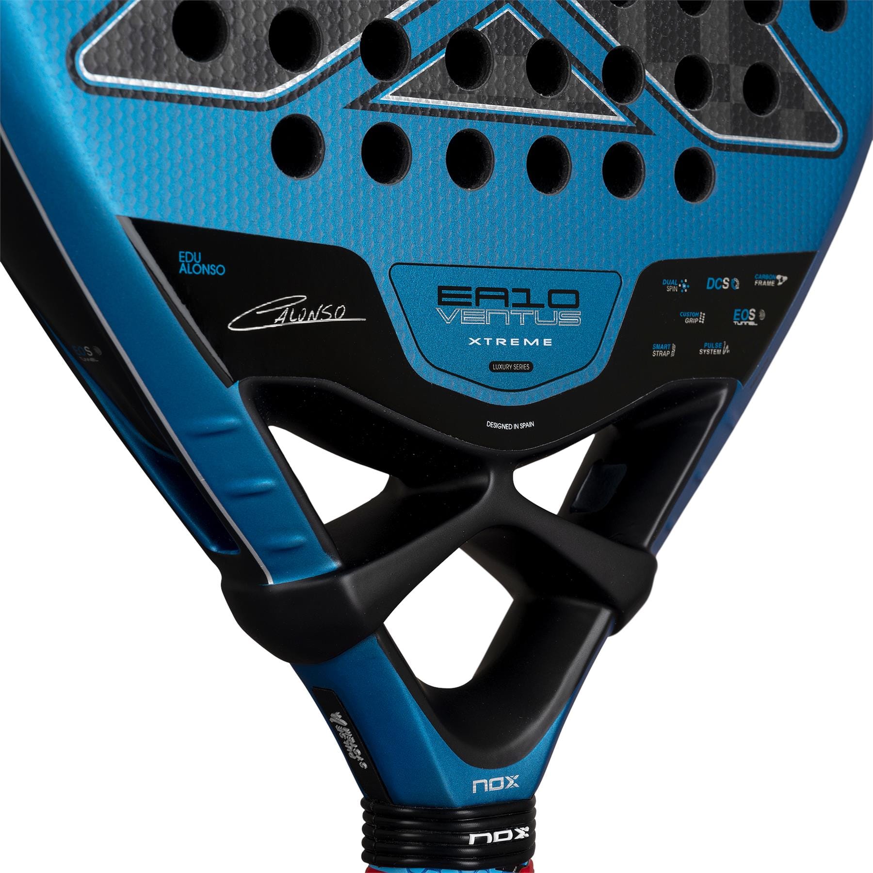 Close-up of the NOX Luxury EA10 Ventus Attack 12K XTREM By Edu Alonso 2026 padel racket in blue and black, showing the brand NOX, model details, 12K XTREM Carbon design, and multiple logos on the racket head.