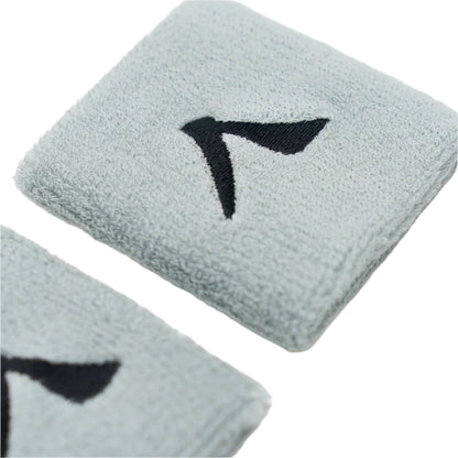 Close-up of two Kanso 7cm Wristbands from Kanso, featuring a black abstract logo on a white surface. Made from absorbent fabric, these gray bands provide maximum comfort with their soft, textured design.