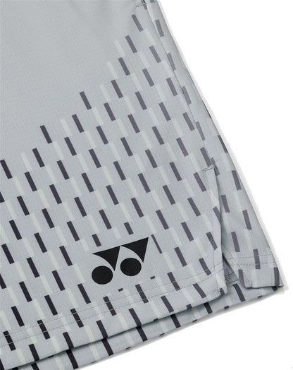 A close-up of Yonex 15241EX Knit Men's Padel Shorts in Silver Grey shows diagonal dark gray lines and the Yonex logo—two dots and a triangle—in black at the hem, offering moisture-wicking comfort for high performance.