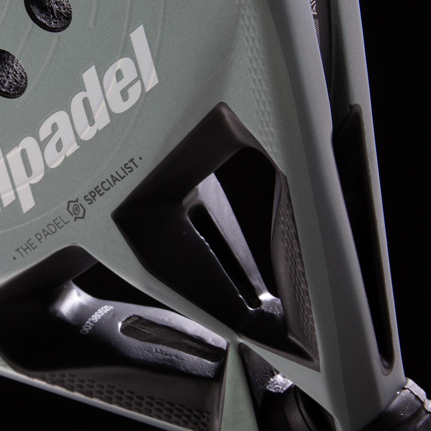 Close-up of the Bullpadel HACK 04 2026 Padel Racket in Black/Grey by Bullpadel, featuring "THE PADEL SPECIALIST" print, detailed frame texture, and dynamic power design against a dark background.