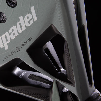 Close-up of the Bullpadel HACK 04 2026 Padel Racket in Black/Grey by Bullpadel, featuring "THE PADEL SPECIALIST" print, detailed frame texture, and dynamic power design against a dark background.