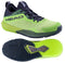 The HEAD Motion Pro Mens Padel Shoes in lime and navy feature advanced DynaFoam cushioning, a textured sole for 360-degree movement, and a breathable mesh upper. "HEAD" is displayed on the side; one shoe shows the tread pattern while the other is viewed from the side.