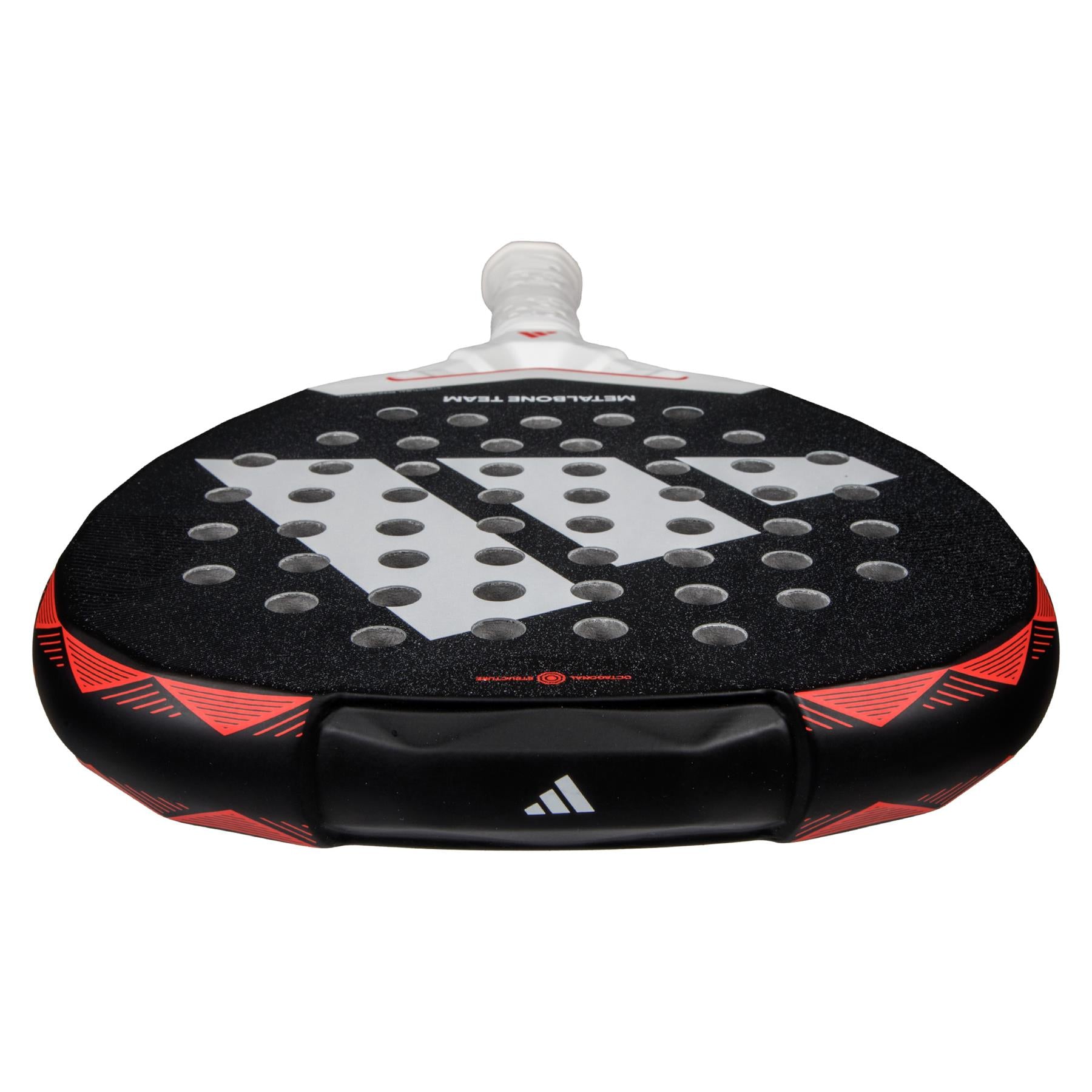 A close-up of an ADIDAS Metalbone Team 3.4 Padel Racket - Black/Red, featuring a textured surface and circular holes. Designed for advanced players, it boasts a white handle, geometric patterns, and the adidas logo in striking black and red tones.