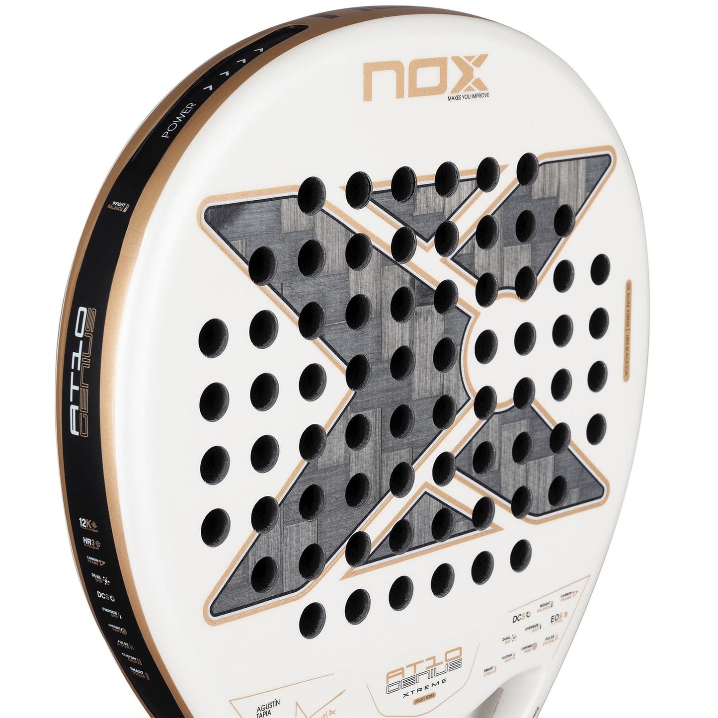 Close-up of the NOX AT10 Genius 12K Alum Extrem By Agustín Tapia 2026 Padel Racket by NOX, showcasing its white and black design, bold "X," and multiple circular holes on the striking surface.