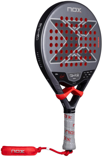 The NOX ML10 Ventus Control 3K by Miguel Lamperti 2026 is a black and gray padel racket with red details, a large "X" on the face, circular perforations, gray grip with red accents, and a branded red "nox" wrist strap—built for top control.