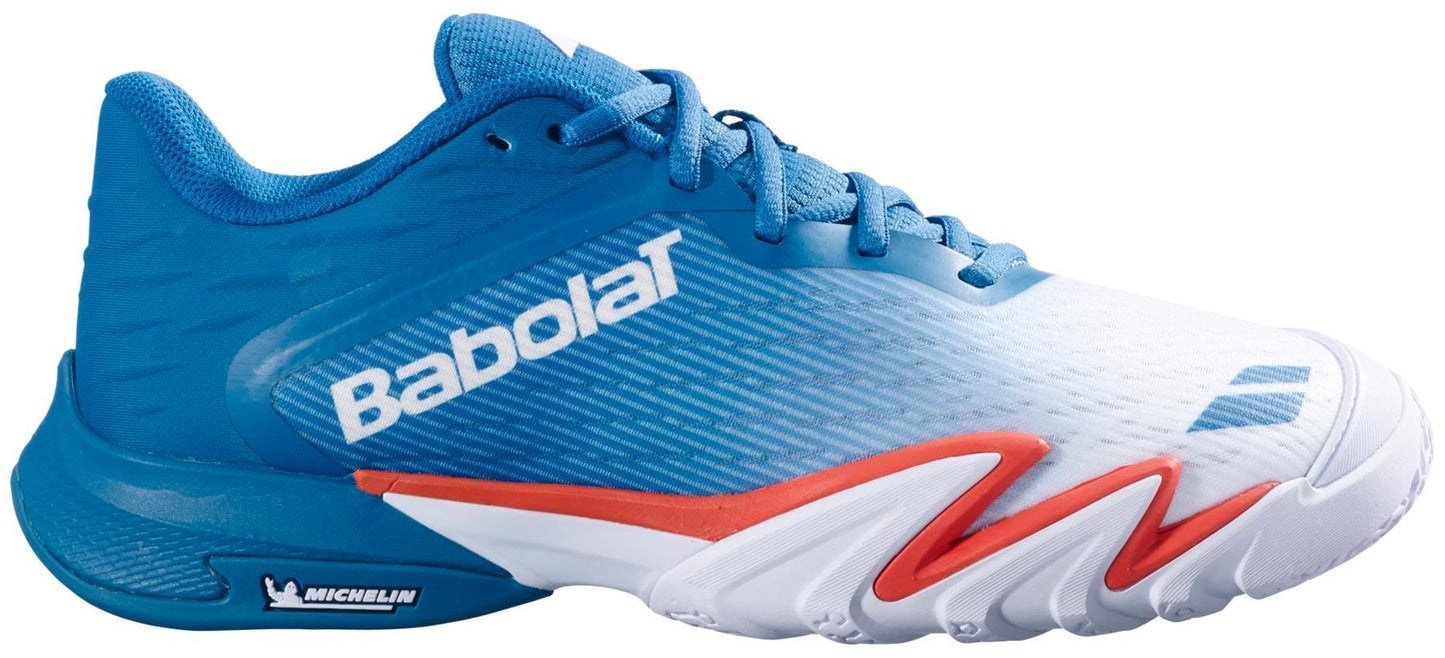 The Babolat Premura 3 Men's Padel Shoes - Seaport feature blue, white, and red colors with zigzag red accents, a thick sole, Michelin logo on the heel, mesh upper for breathability, and laces for a secure fit.