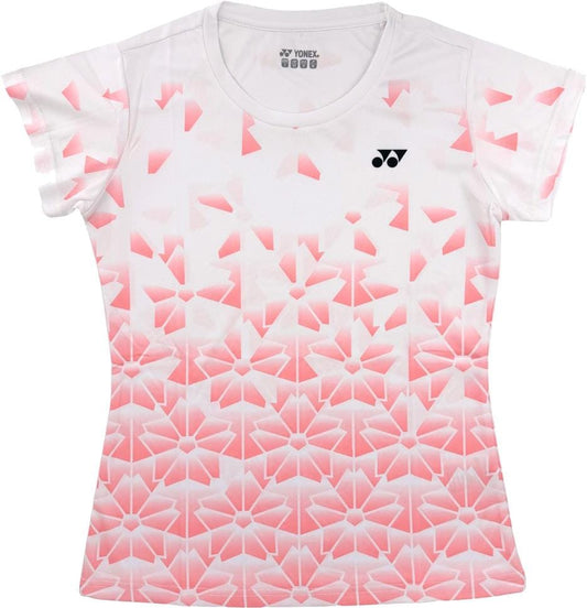 The Yonex YTL2025B Womens Padel T-Shirt in white features a gradient pink geometric floral design, breathable sports fabric, and the Yonex logo on the left chest.
