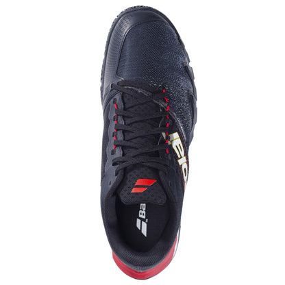 Top view of Babolat Jet Premura 2 Men's Padel Shoes in black and tomato red, with black laces and yellow-white Babolat branding. Features Michelin Padel technology. Photographed on a white background.