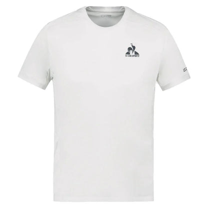 Optical White Le Coq Sportif Pro Men's Padel T-Shirt made from breathable polyester, showcasing a small "Le Coq Sportif" logo on the left chest and the brand name on the left sleeve. This T-shirt features short sleeves and a crew neckline for optimal comfort.