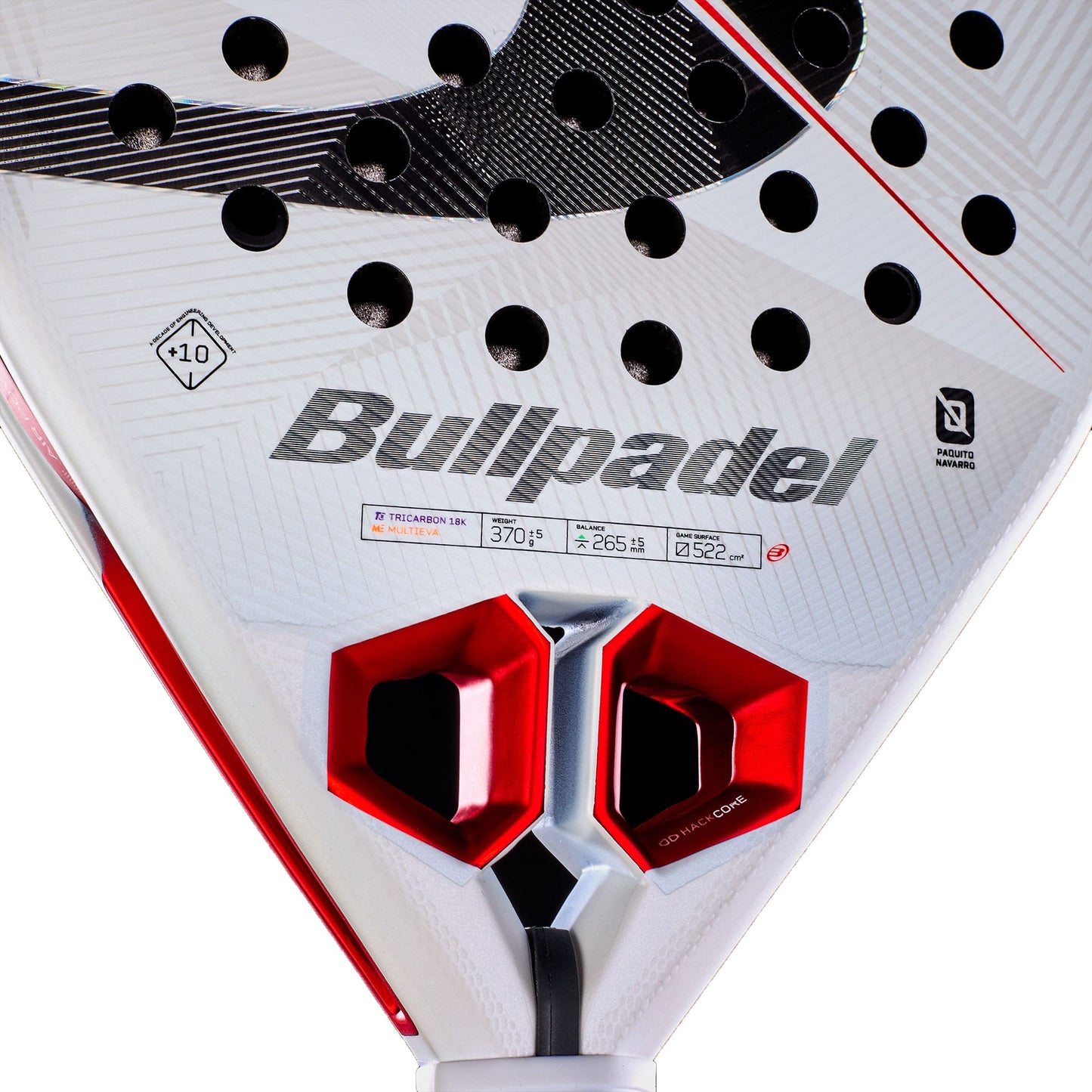 Close-up of the Bullpadel Hack 05 2027 Padel Racket by Bullpadel, an advanced padel racket showcasing a bold white and red color scheme, prominent branding, black holes designed for enhanced aerodynamics, and two distinctive hexagonal red ventilation systems near the handle.