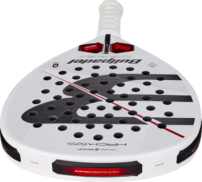 A close-up of the Bullpadel Hack 05 2027 Padel Racket by Bullpadel, showcasing its white design with black and red accents, a perforated surface, and the word “HACK” displayed near the handle. This high-performance padel racket is crafted for advanced play.