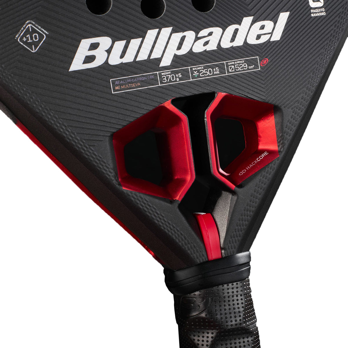 Close-up of the Bullpadel Hack 05 Hybrid 2027 Padel Racket in black and red, showcasing the Bullpadel logo, technical specifications (370-375g, 250-265mm), and a handle wrapped in black grip tape. The racket stands out for its advanced Aluminized Carbon 18K surface and MultiEva core, offering superior performance on the court.