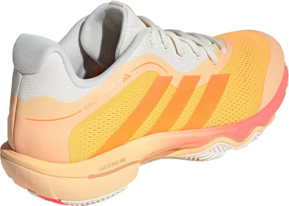 The adidas Crazyflight 7 Indoor Mens Padel Shoes in Lucid Tangerine/Lucid Orange/Off White feature white laces, mesh upper, three orange stripes, LightstrikePro cushioning, colorful accents, and "Lightstrike Pro" printed on the side.