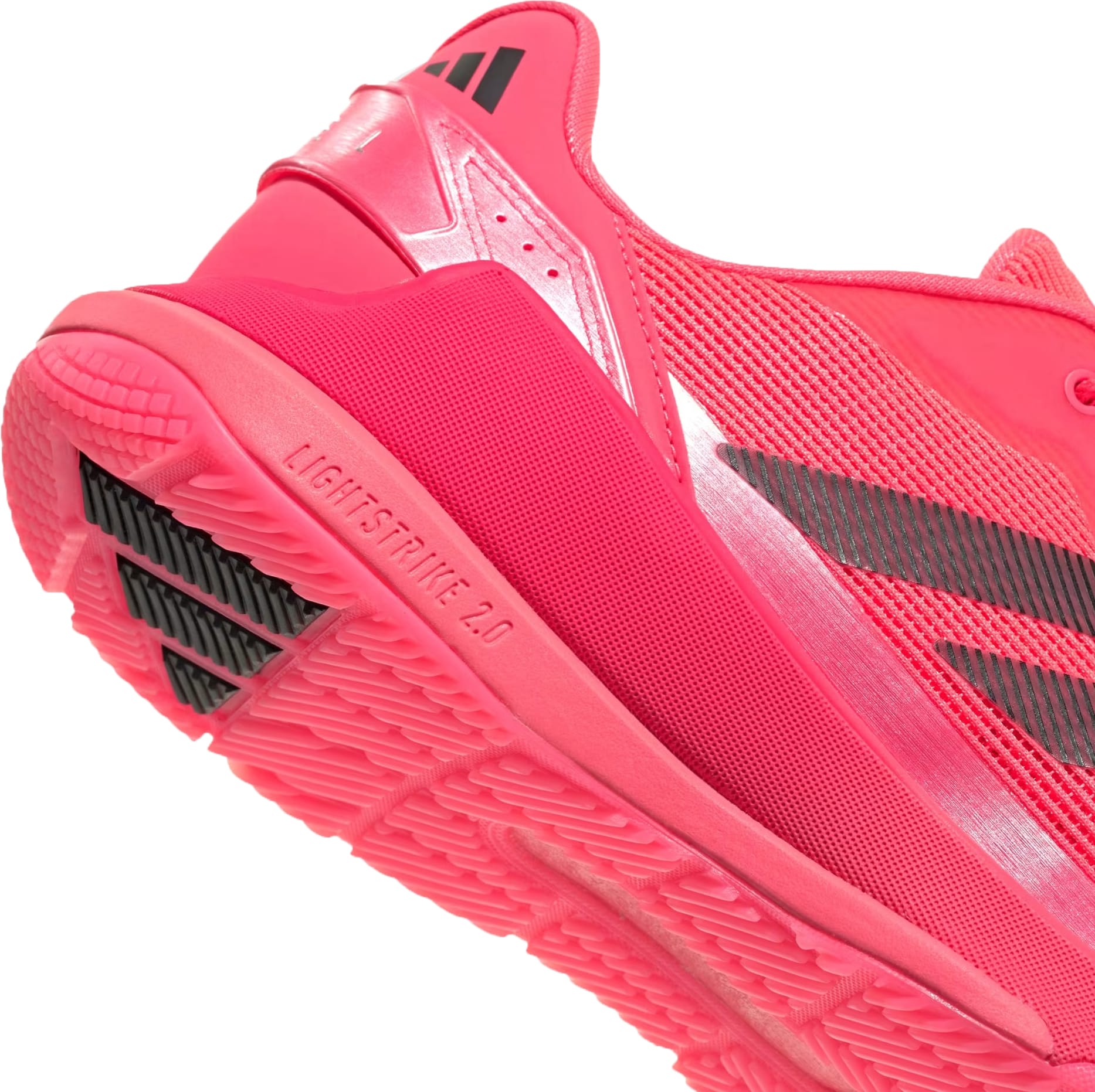 Close-up of adidas Crazyquick LS Mens Padel Shoes in Solar Turbo/Core Black/Lucid Red, showing the breathable mesh upper, multi-directional grip tread, and "LIGHTSTRIKE 2.0" embossed on the sole.