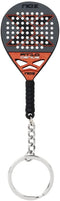The NOX AT10 Genius 18K Padel Racket Keychain by NOX features a black and orange miniature racket inspired by Agustin Tapia, with white holes, textured grip, and a silver chain attached to a round keyring.