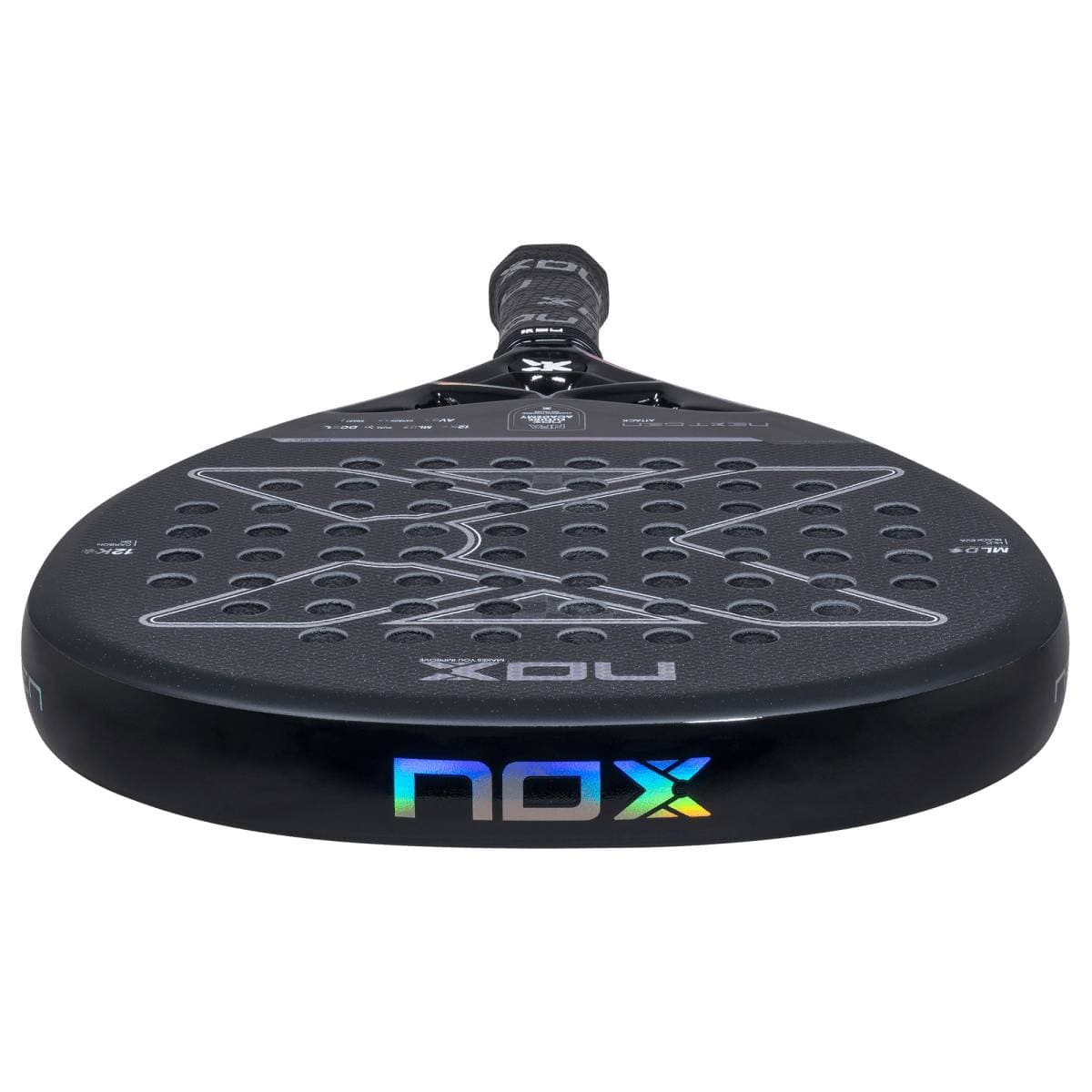 The NOX NextGen Pro Attack 12K NFA 2026 Padel Racket features a black, round head with multiple perforations and a textured 12K carbon surface. The "NOX" logo in silver and iridescent hues is displayed near the bottom edge.