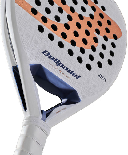 Close-up of the Bullpadel Pearl 2027 Padel Racket in white by Bullpadel, featuring black holes, an orange design, and a blue accent near the handle. Designed for advanced players who prefer an attacking style, it showcases a textured surface with subtle patterns and Bullpadel branding.