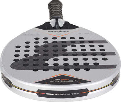 A close-up of a gray and black padel racket with circular holes, a textured grip, and the brand “Bullpadel” on top. The bottom features “VERTEX” and “CUSTOM WEIGHT SYSTEM” text, highlighting the Bullpadel Vertex 05 Hybrid 2027 Padel Racket’s unique hybrid head shape and advanced MultiEva core for enhanced performance.