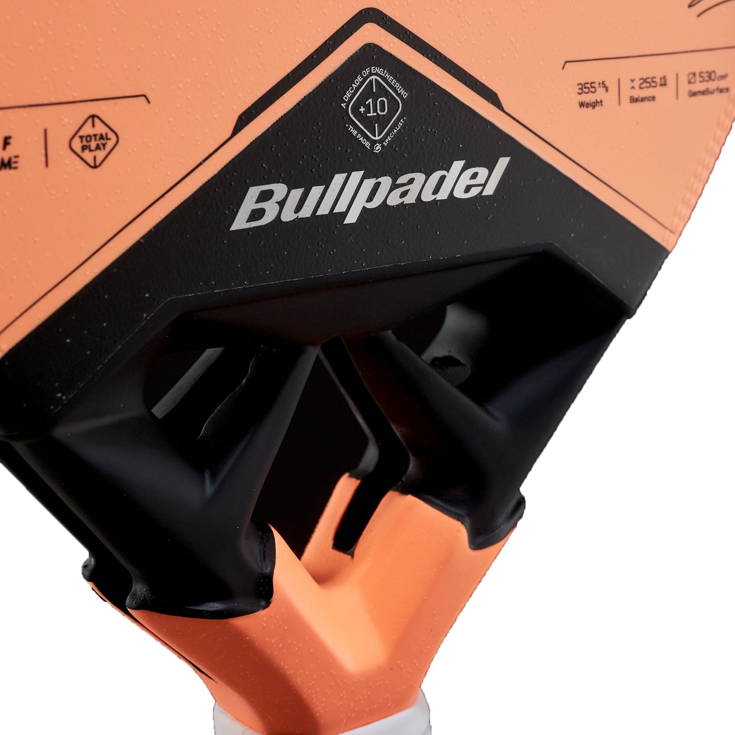 Detailed view of the orange Bullpadel Vertex 05 W 2027 Padel Racket, featuring the prominent Bullpadel logo, balance point, and technical specifications near the handle. This high-performance padel racket boasts innovative design elements for exceptional play.