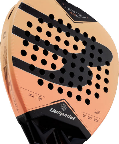 Close-up of the Bullpadel Vertex 05 W 2027 Padel Racket, showcasing its orange and black design with multiple round holes and visible Bullpadel branding.
