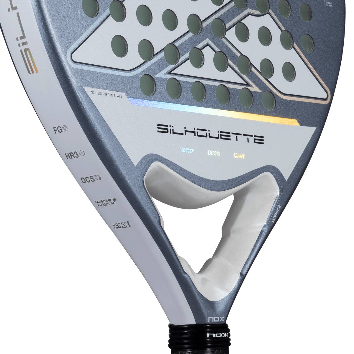 Close-up of the NOX X-One Silhouette 2026 Padel Racket by NOX, featuring a gray and white design with circular holes on the head and a black grip—an ideal choice for beginner padel players.
